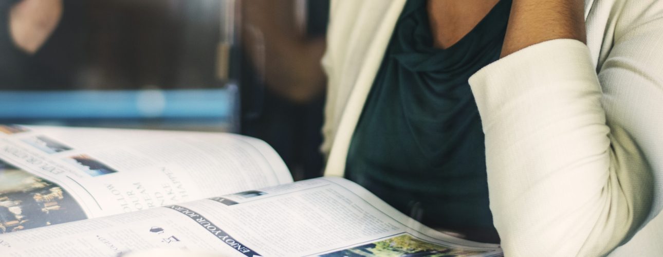 Businesswoman reading the daily news