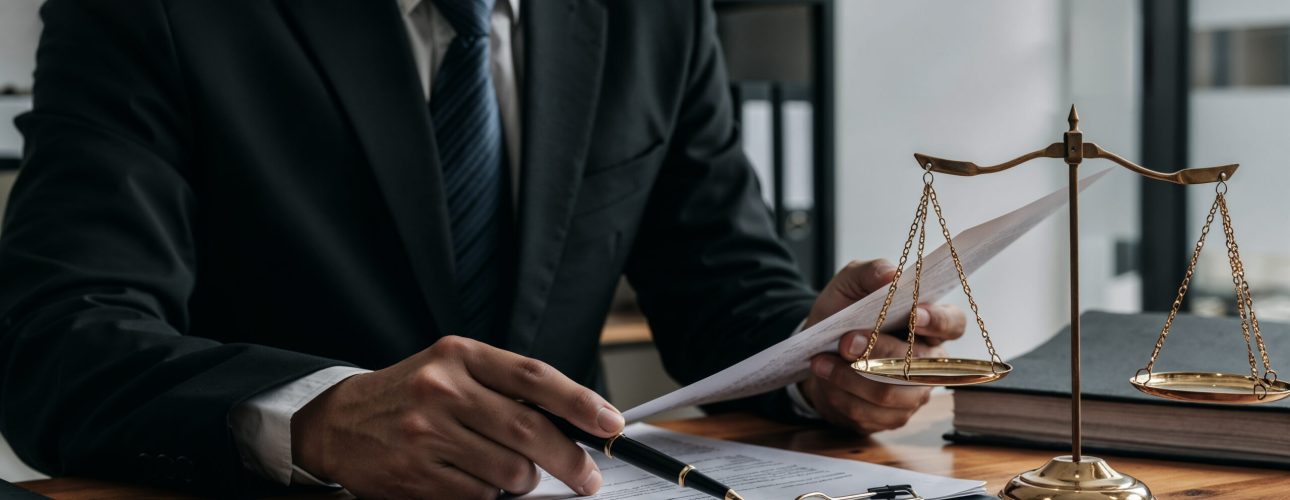 lawyer-working-document-with-scales-justice